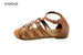 bebe Girls Gladiator Sandal with Hardware Embellishments